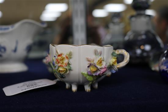 A Meissen flower encrusted cup and saucer